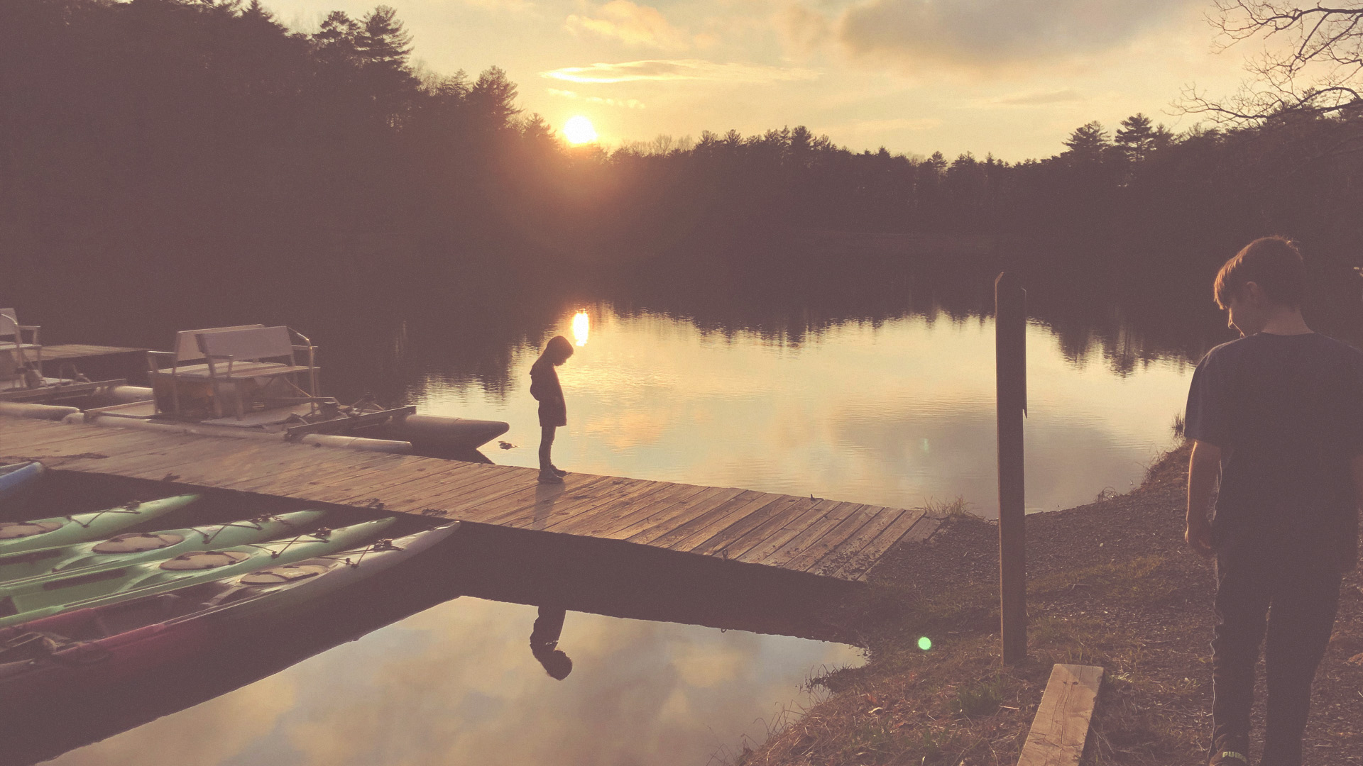 Sunset over the lake and dock at Fort Mountain State Park